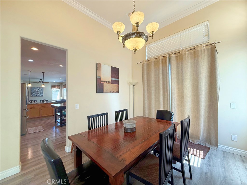 23964 Old Pomegranate Road Yorba Linda, CA 92887 - Photo 14 of 30 a view of a dining room with furniture window and wooden floor