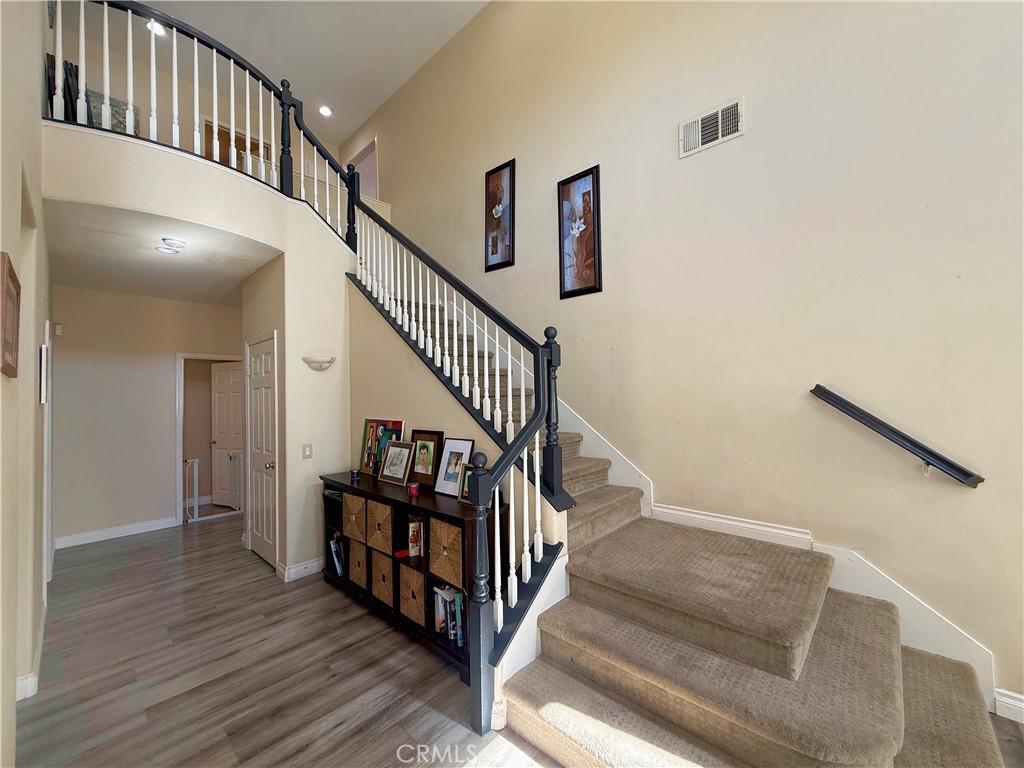 23964 Old Pomegranate Road Yorba Linda, CA 92887 - Photo 17 of 30 a view of staircase with wooden floor and white walls