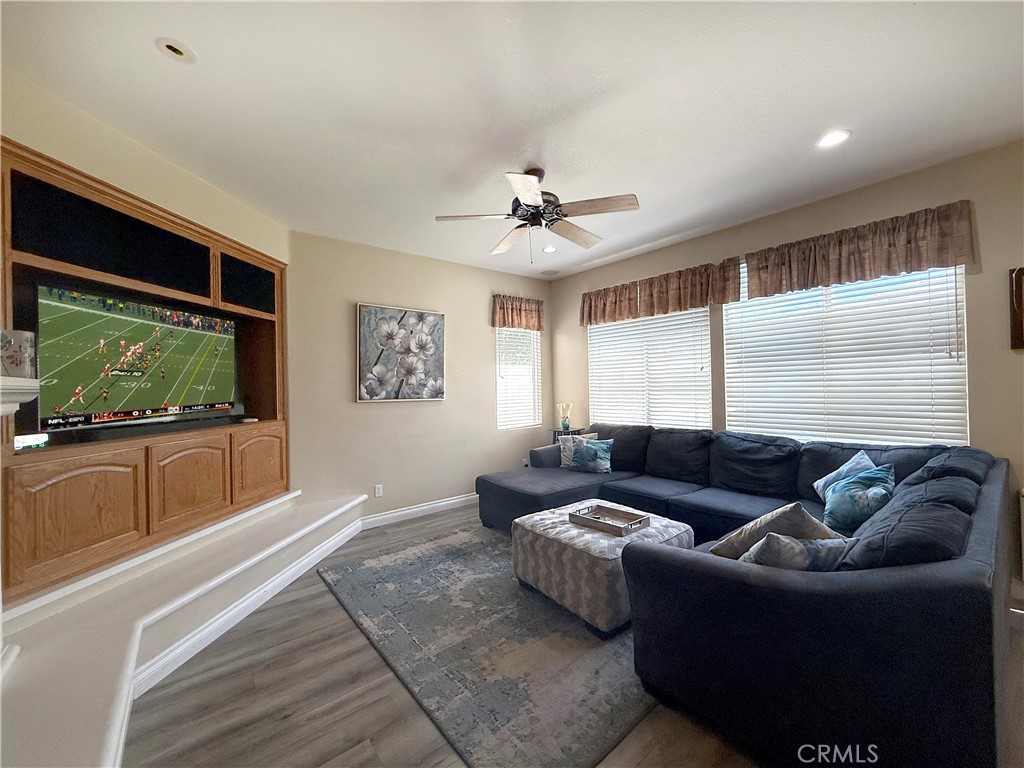 23964 Old Pomegranate Road Yorba Linda, CA 92887 - Photo 8 of 30 a living room with furniture and a flat screen tv