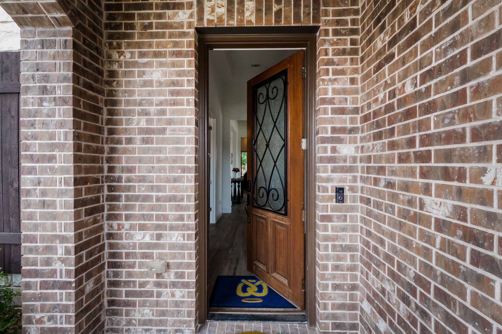 140 Waterloo Cove Georgetown, TX 78628 - Photo 4 of 40 A welcoming entry invites you in, framed by robust brickwork and a charming open doorway.