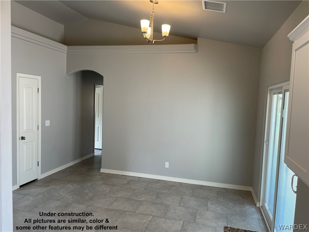 3555 North Kenneth Road Kingman, AZ 86409 - Photo 11 of 19 a view of an empty room with a window