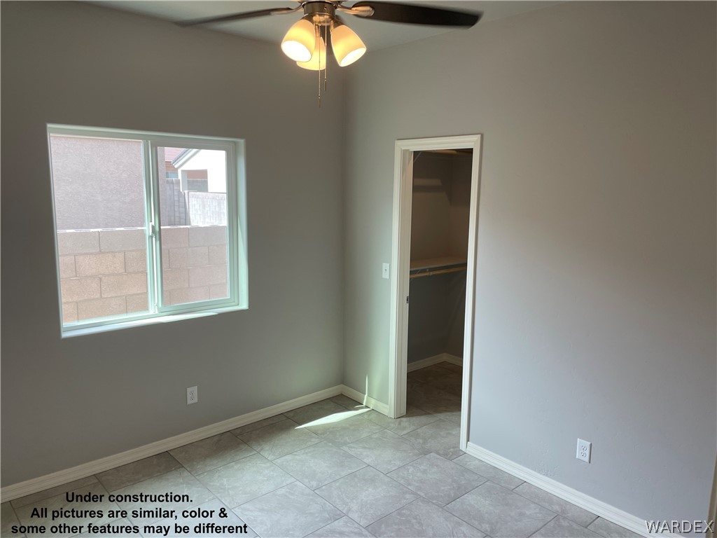3555 North Kenneth Road Kingman, AZ 86409 - Photo 15 of 19 an empty room that has a window