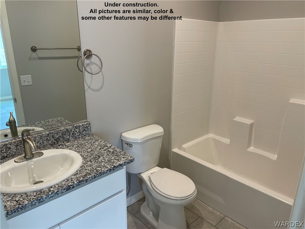 3555 North Kenneth Road Kingman, AZ 86409 - Photo 17 of 19 a bathroom with a sink a toilet and shower