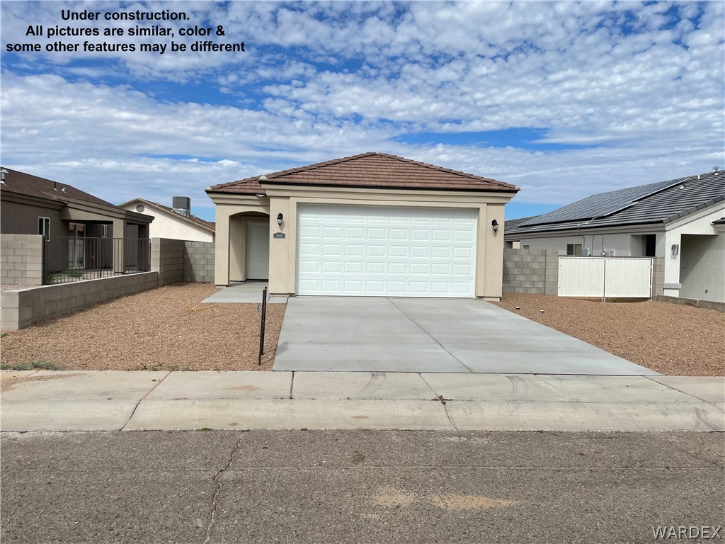 3555 North Kenneth Road Kingman, AZ 86409 - Photo 2 of 19 a house with a outdoor space