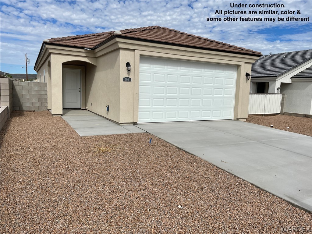3555 North Kenneth Road Kingman, AZ 86409 - Photo 3 of 19 a view of garage and yard