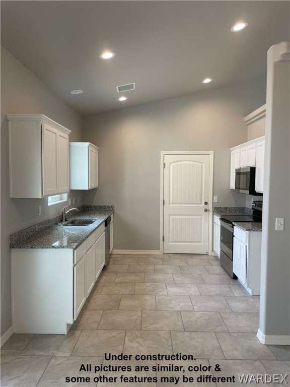 3555 North Kenneth Road Kingman, AZ 86409 - Photo 8 of 19 a large kitchen with cabinets