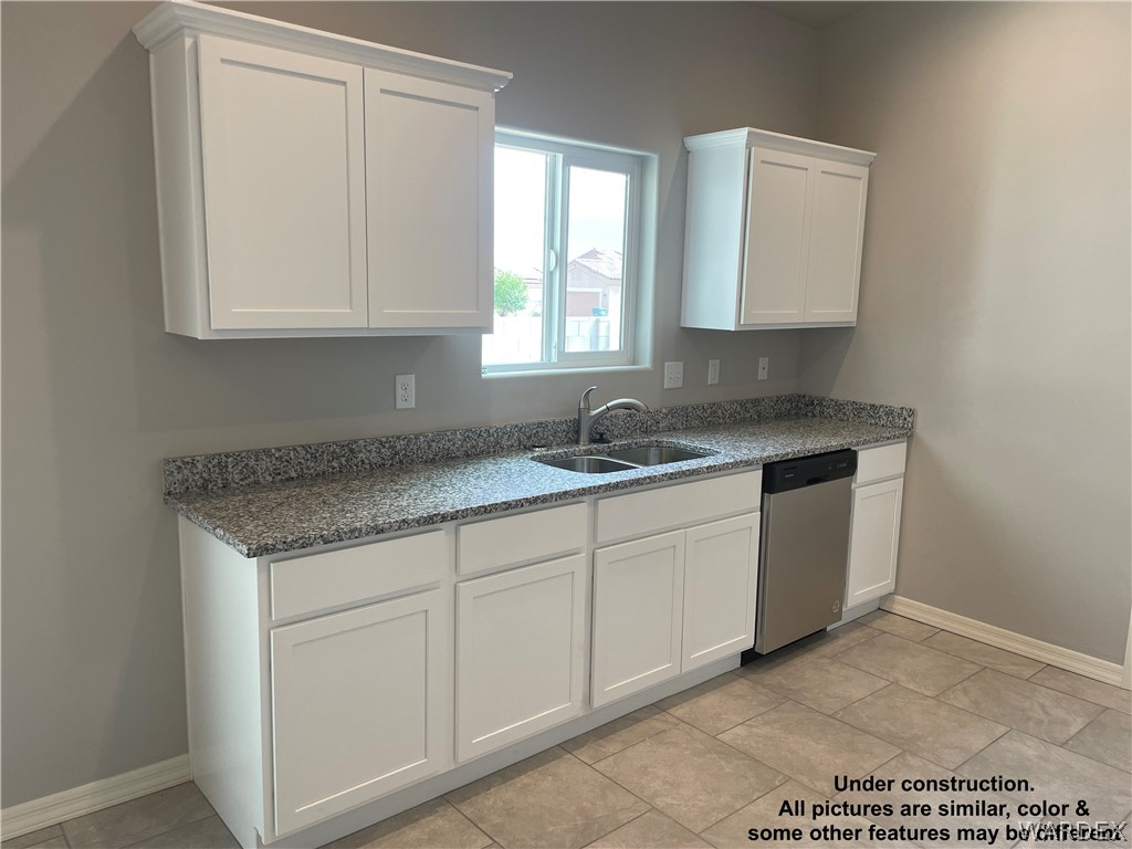 3555 North Kenneth Road Kingman, AZ 86409 - Photo 10 of 19 a kitchen with granite countertop white cabinets and sink