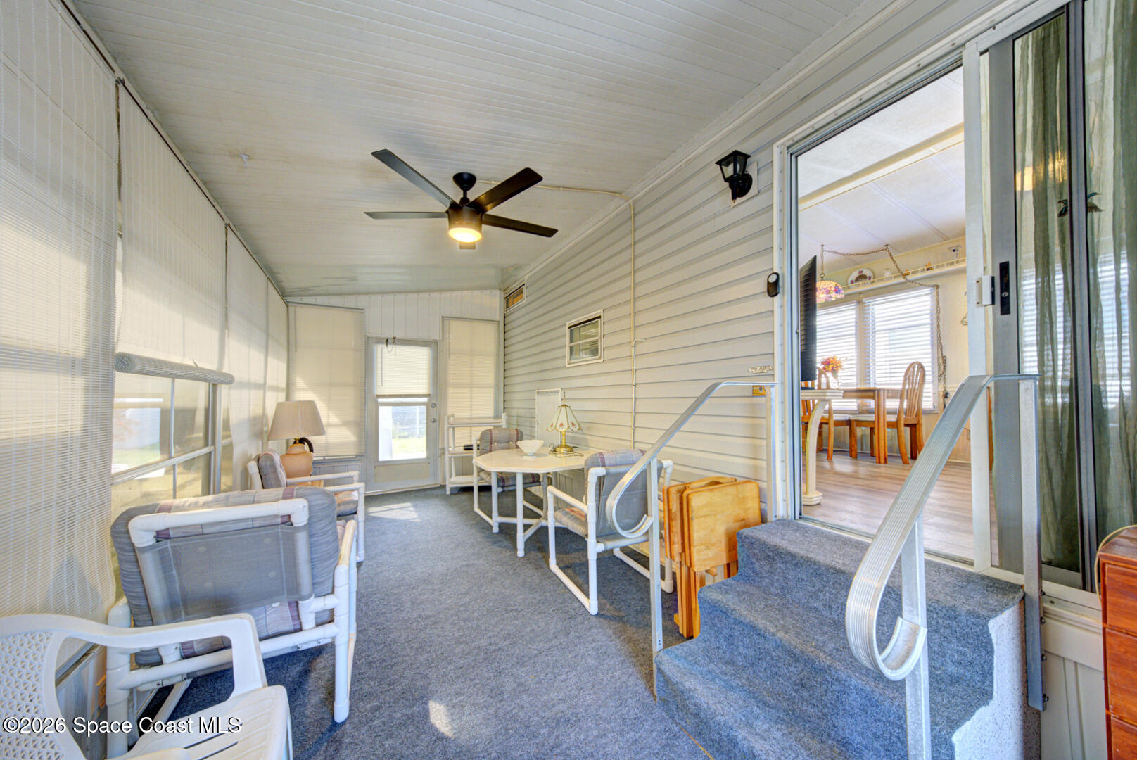 283 Buffalo Place Rockledge, FL 32955 - Photo 6 of 23 a view of a dining room with furniture a chandelier and wooden floor