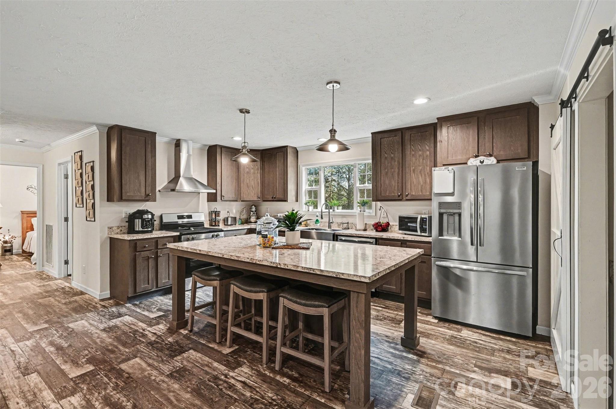 420 Hoffman Road Lincolnton, NC 28092 - Photo 1 of 25 a kitchen with kitchen island granite countertop a sink stove and refrigerator