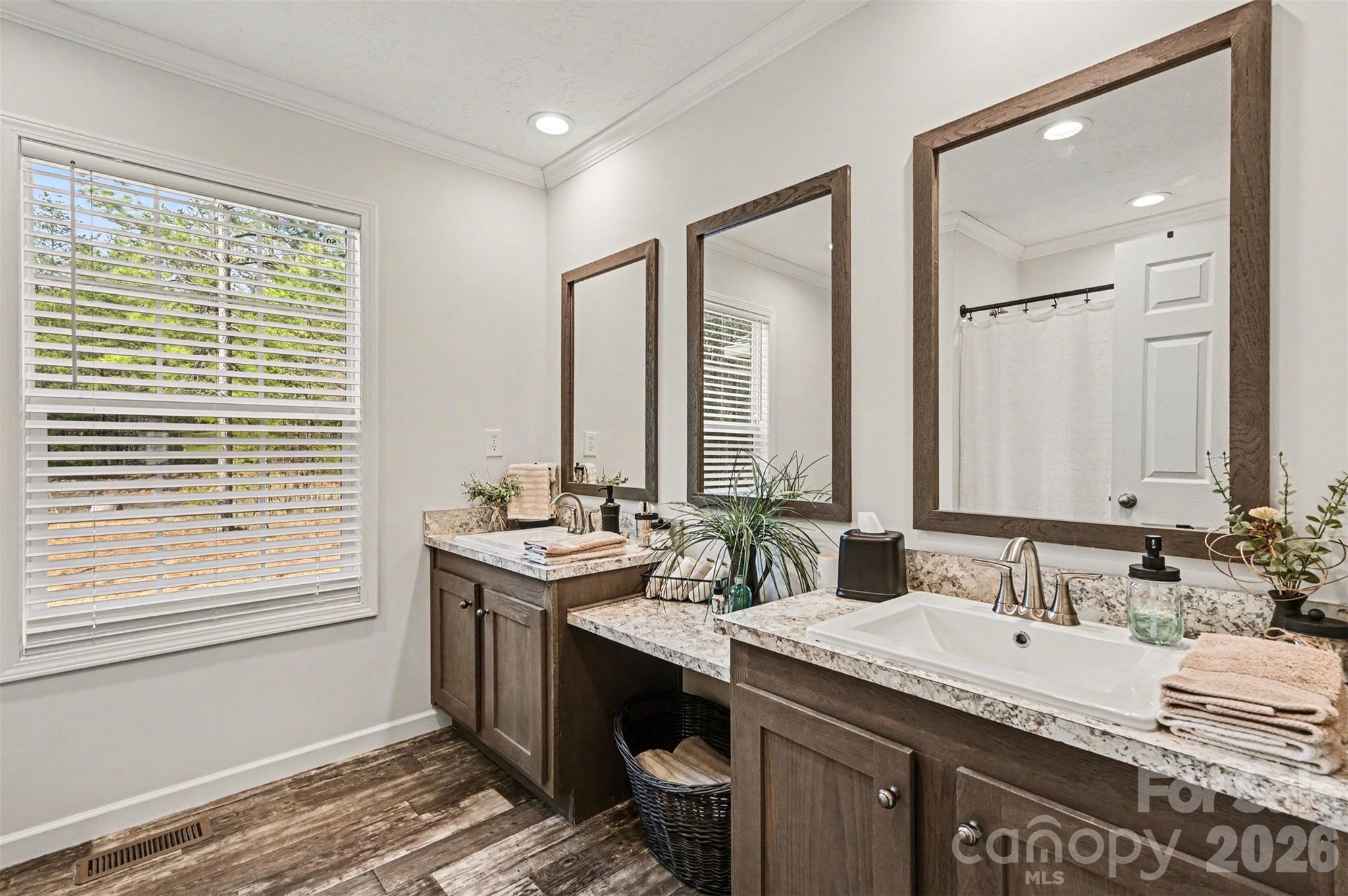 420 Hoffman Road Lincolnton, NC 28092 - Photo 13 of 25 a spacious bathroom with a granite countertop sink and a window