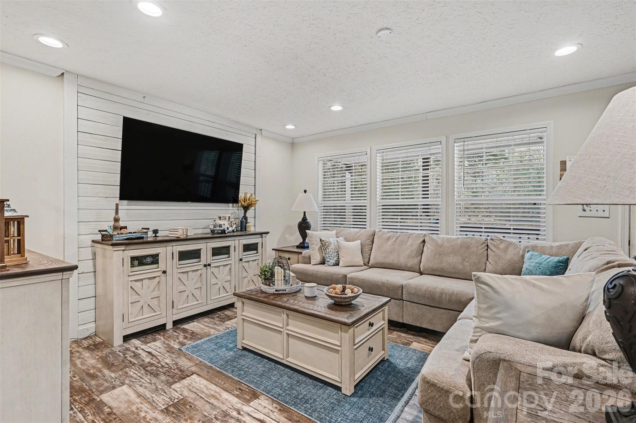 420 Hoffman Road Lincolnton, NC 28092 - Photo 2 of 25 a living room with furniture and a flat screen tv