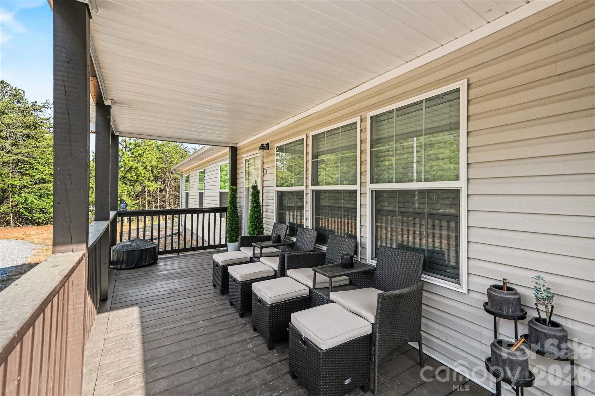 420 Hoffman Road Lincolnton, NC 28092 - Photo 4 of 25 a balcony with furniture and a potted plant