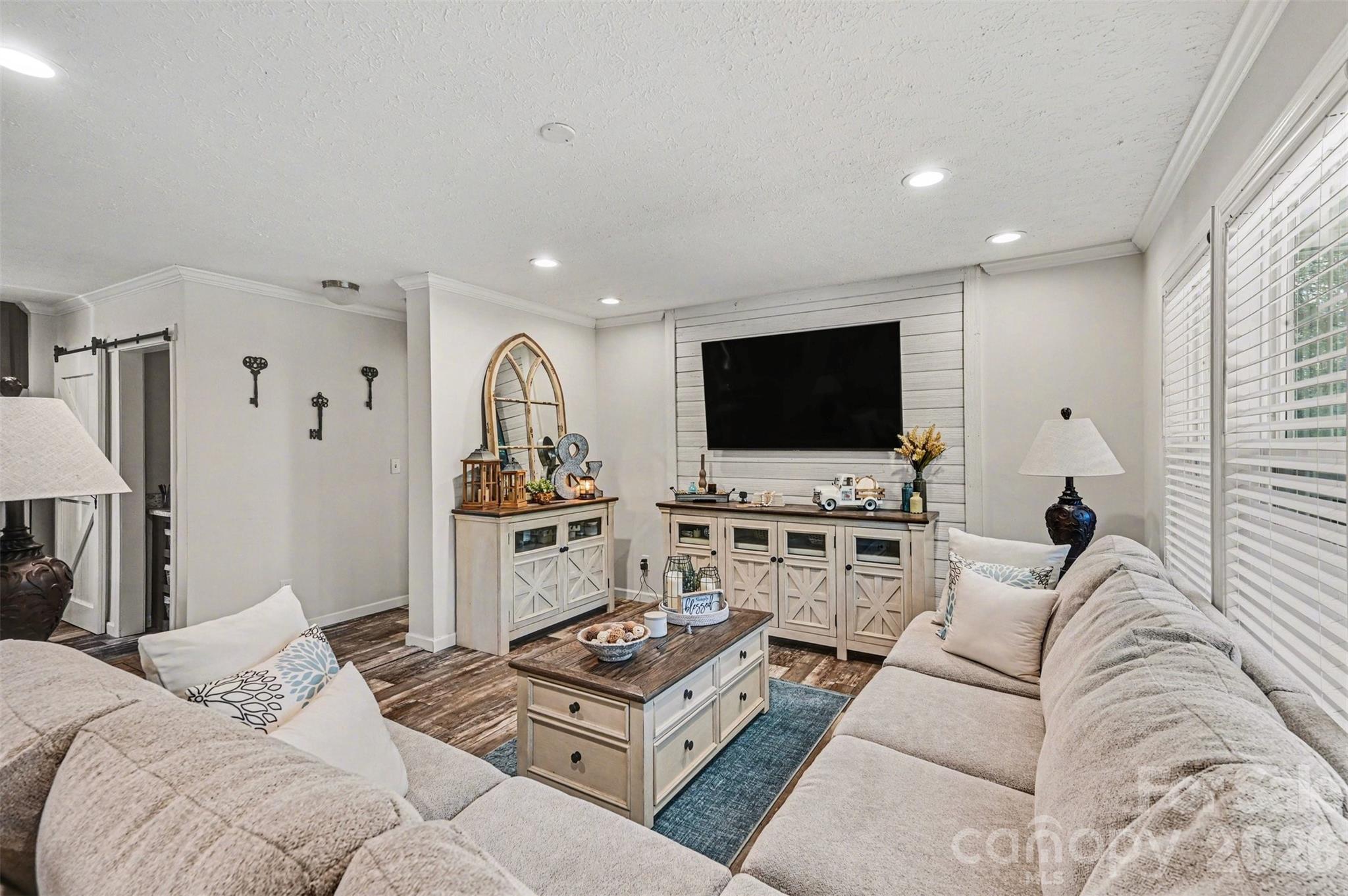 420 Hoffman Road Lincolnton, NC 28092 - Photo 5 of 25 a living room with furniture and a flat screen tv