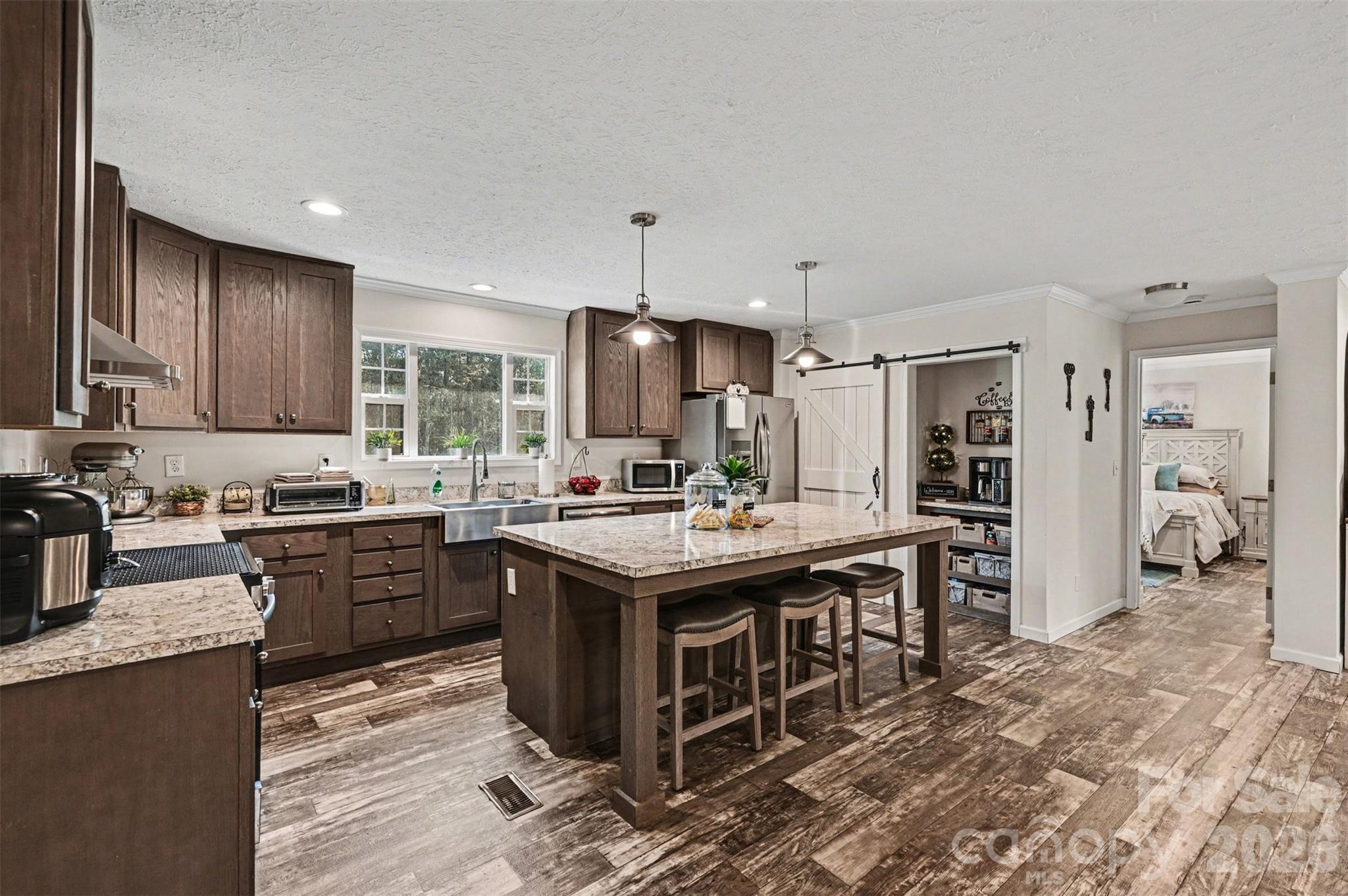 420 Hoffman Road Lincolnton, NC 28092 - Photo 7 of 25 a kitchen with granite countertop a sink stove and refrigerator
