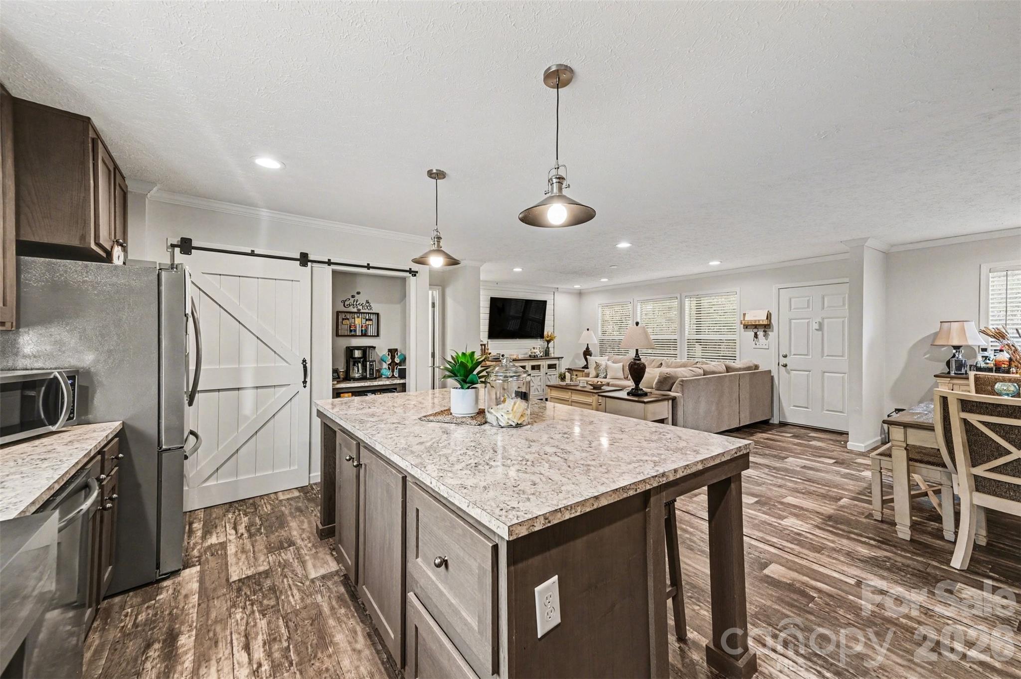 420 Hoffman Road Lincolnton, NC 28092 - Photo 8 of 25 a kitchen with stainless steel appliances granite countertop a sink a refrigerator and a stove