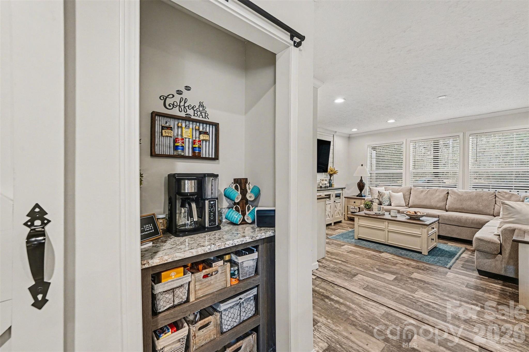 420 Hoffman Road Lincolnton, NC 28092 - Photo 9 of 25 a living room with furniture and a book shelf