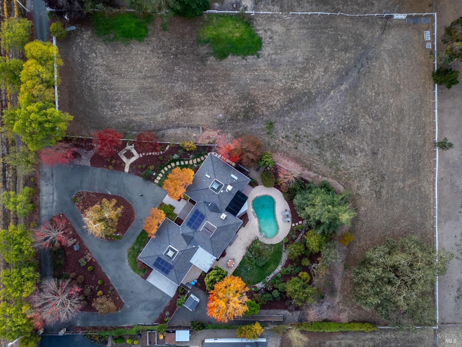1566 Olivet Road Santa Rosa, CA 95401 - Photo 1 of 1 an aerial view of a house a yard and a large tree