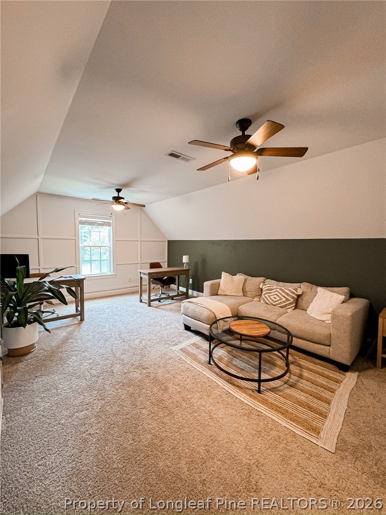 93 Falcon Ridge Drive Spring Lake, NC 28390 - Photo 39 of 50 a living room with furniture gym equipment and a ceiling fan