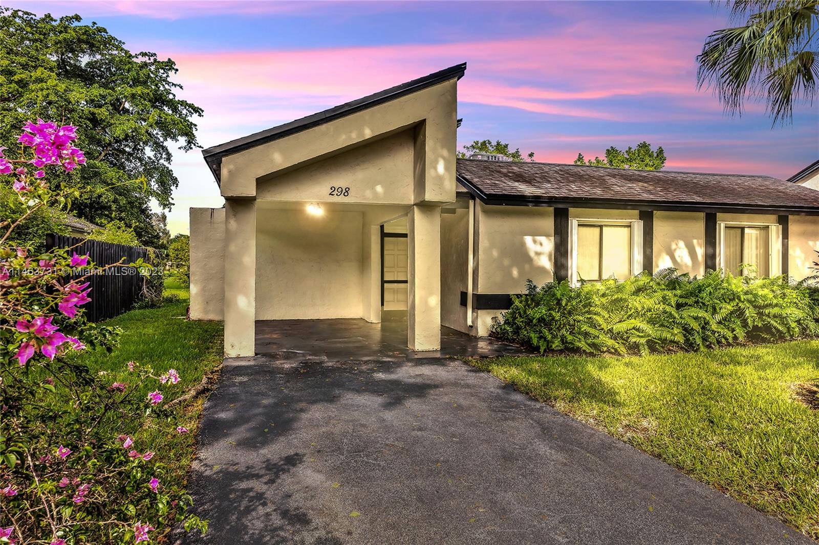 298 Fairway Circle, Unit 73 Weston, FL 33326 - Photo 1 of 57 a front view of a house with a yard