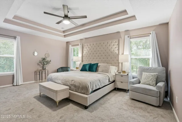 a spacious bedroom with a bed and a couch