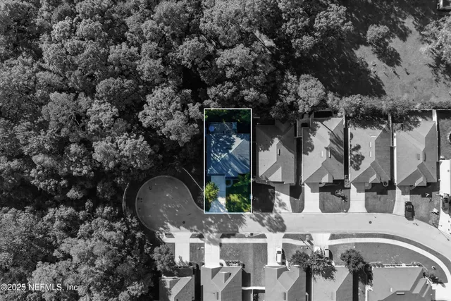 a front view of a house with garden and sitting area