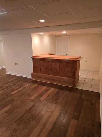 a view of room with wooden floor