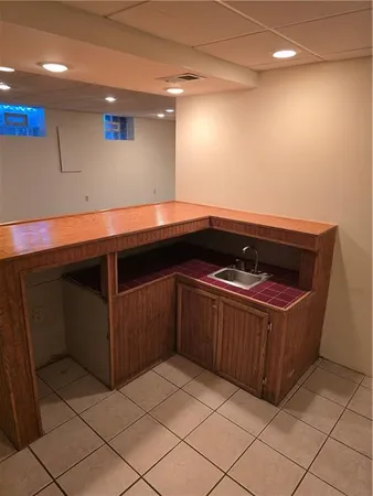 a kitchen with a sink and cabinets