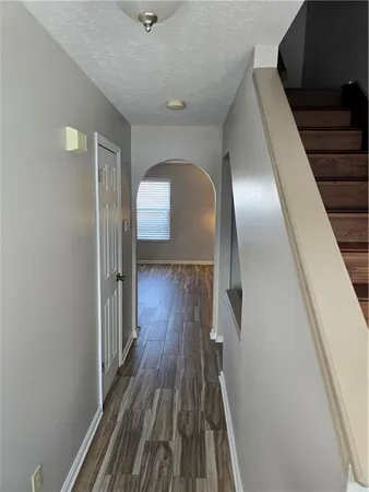 a view of gallery with wooden floor