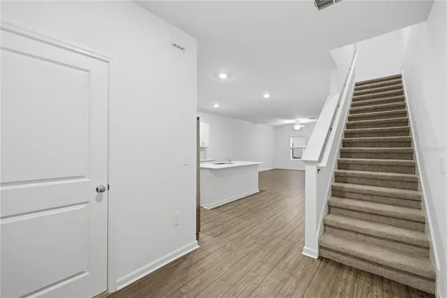 a view of entryway with wooden floor