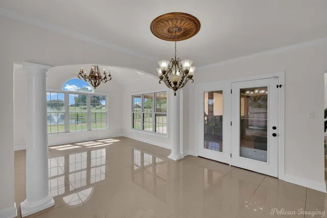 a view of a room with a chandelier and living room