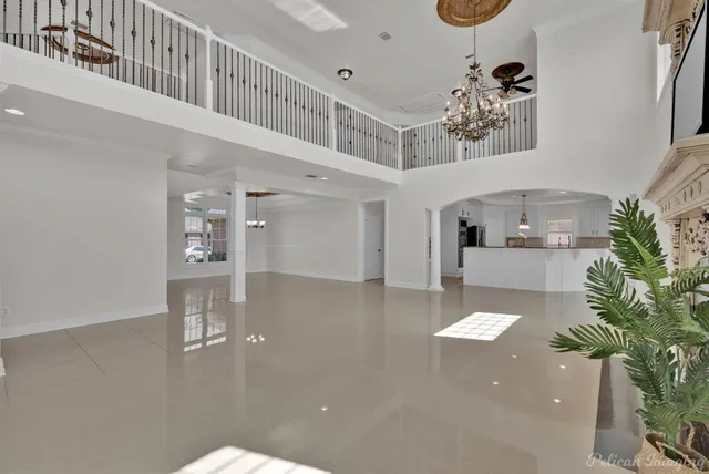 a view of a living room and chandelier