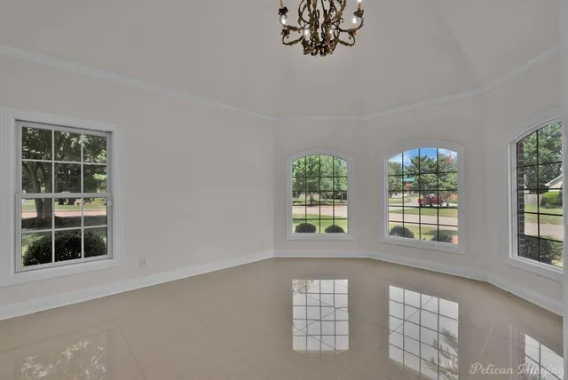 a view of livingroom with furniture wooden floor and windows