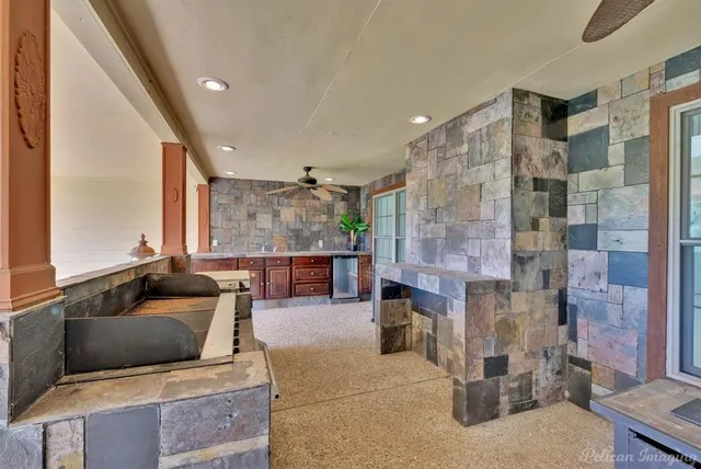 a view of an empty room with a chandelier