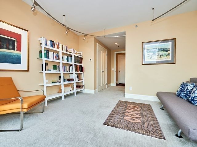 a view of livingroom with furniture and workspace