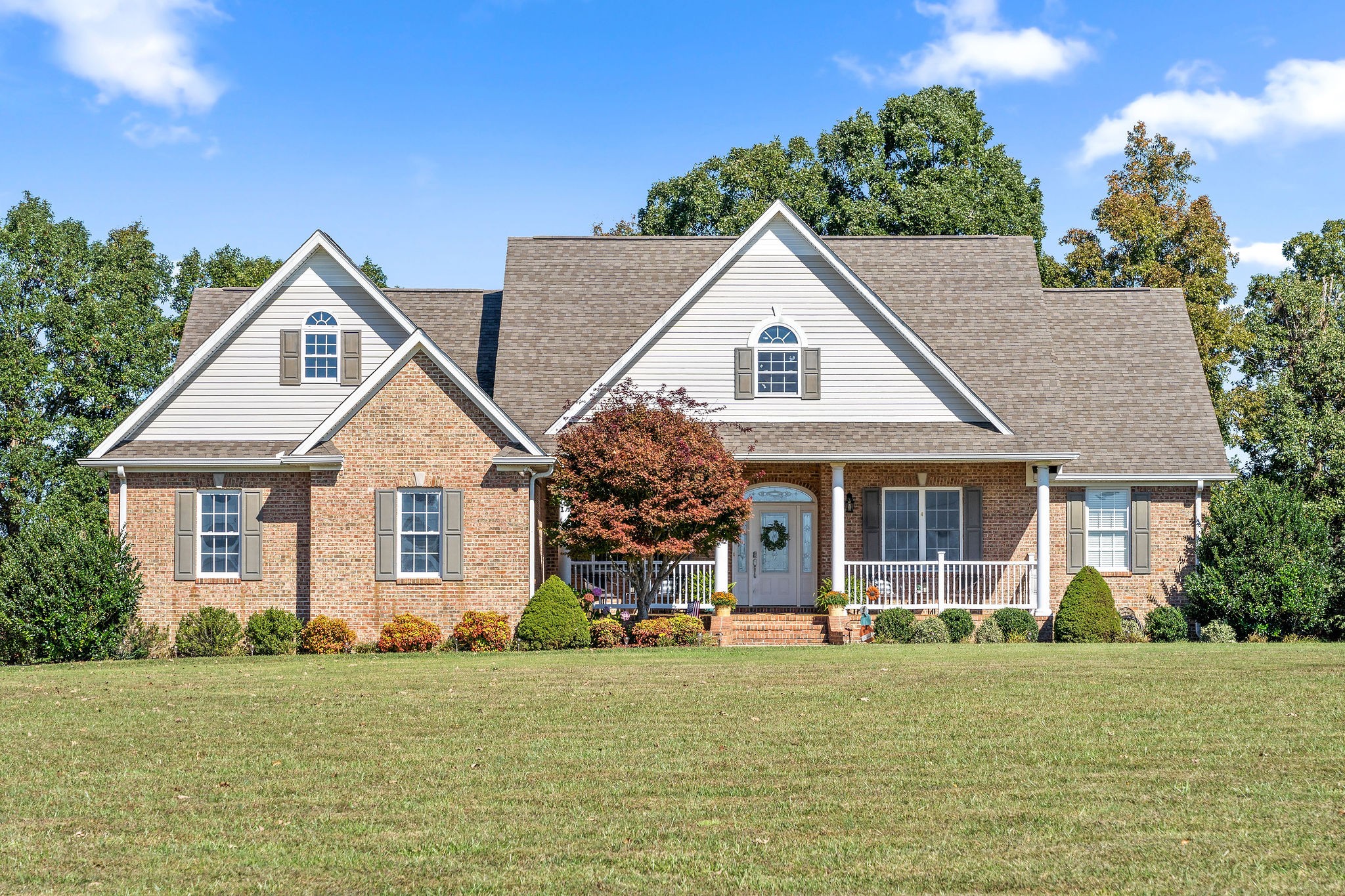 1488 Cooley Ford Road Tennessee Ridge, TN 37178 - Photo 2 of 46 a front view of a house with a garden