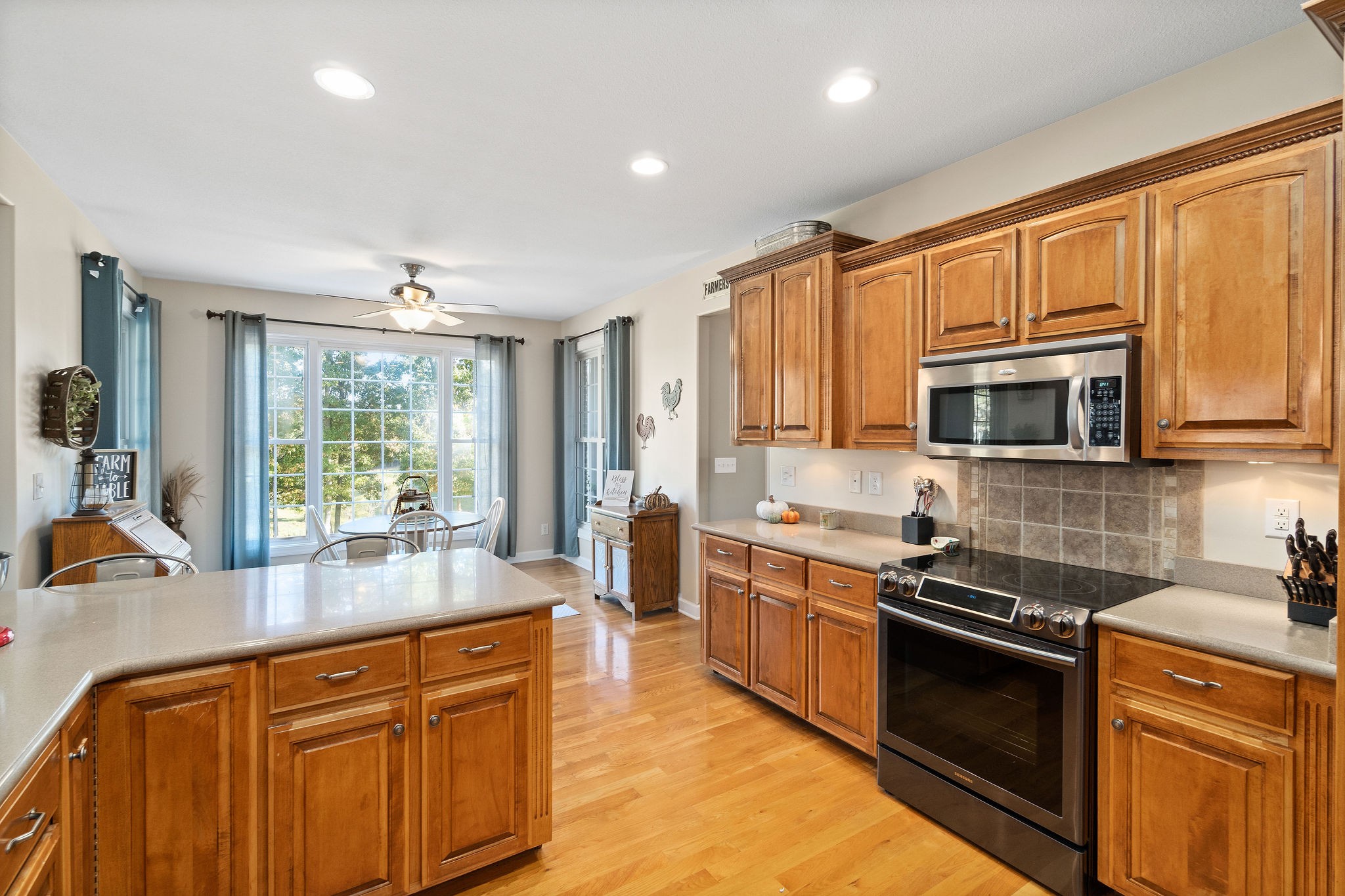 1488 Cooley Ford Road Tennessee Ridge, TN 37178 - Photo 13 of 46 a kitchen with stainless steel appliances granite countertop a stove sink and microwave