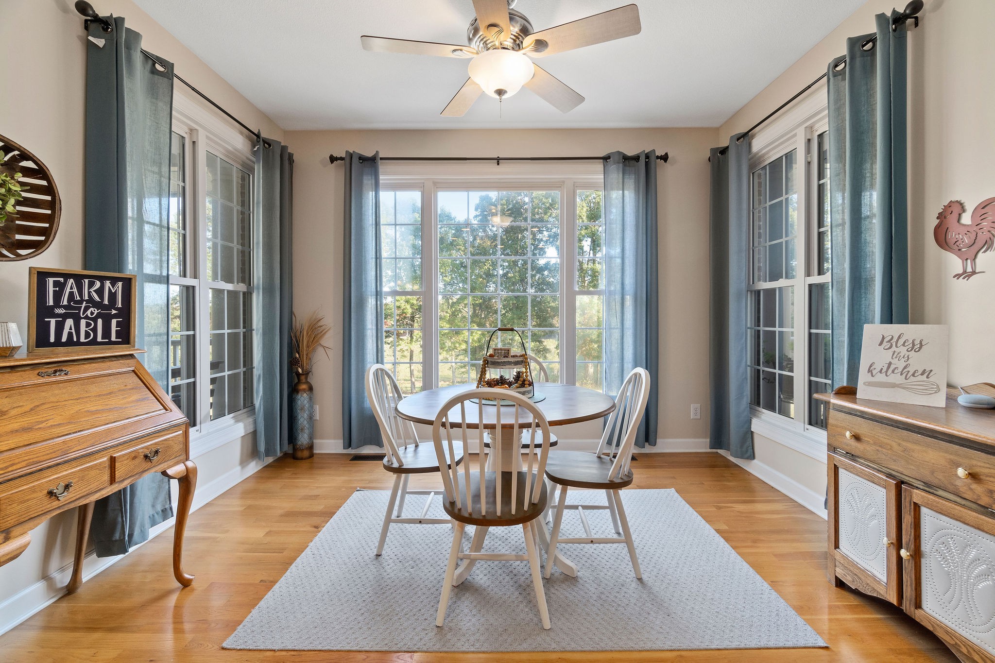 1488 Cooley Ford Road Tennessee Ridge, TN 37178 - Photo 20 of 46 a dining room with furniture and wooden floor