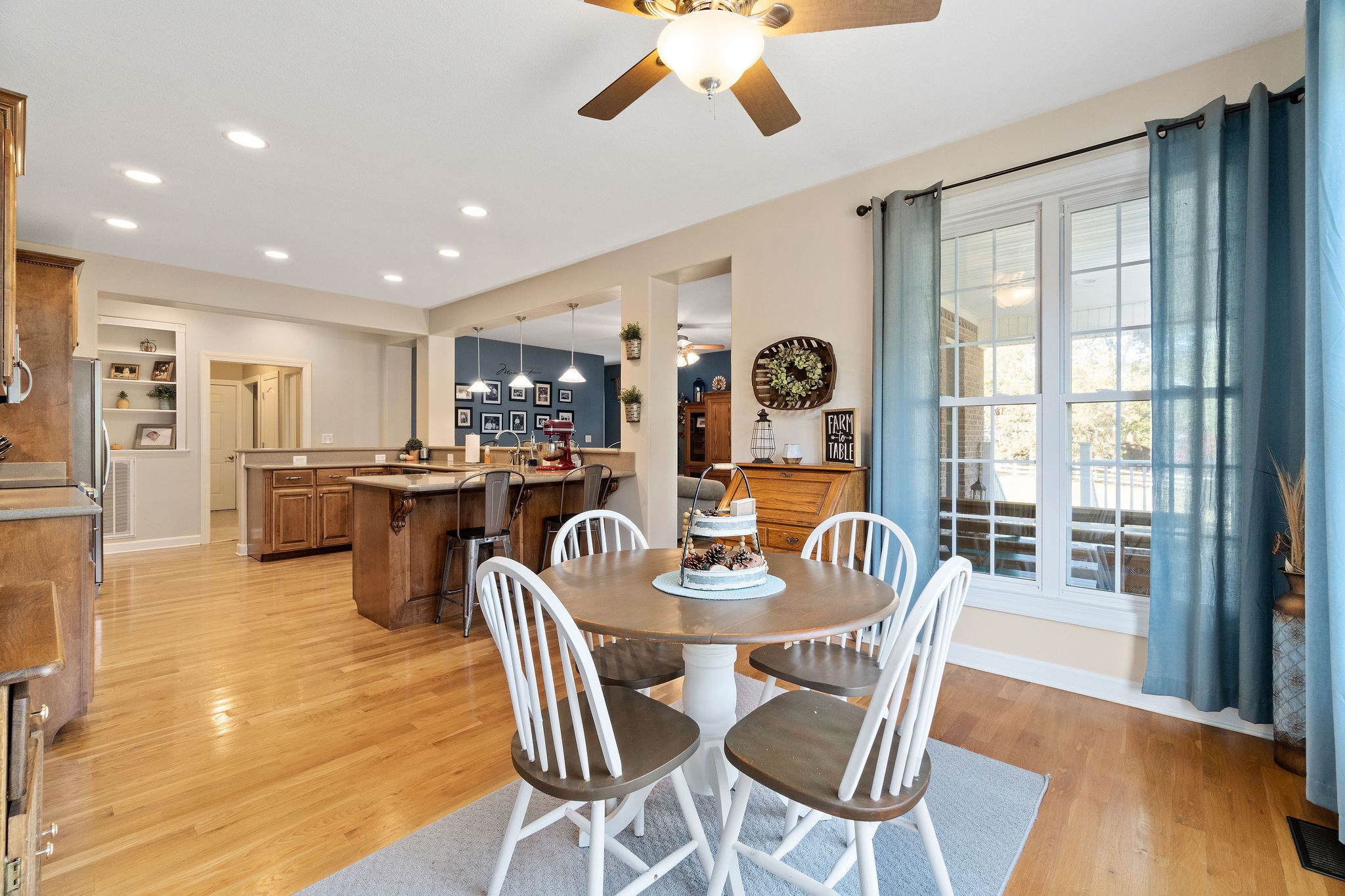 1488 Cooley Ford Road Tennessee Ridge, TN 37178 - Photo 21 of 46 a dining room with furniture and wooden floor