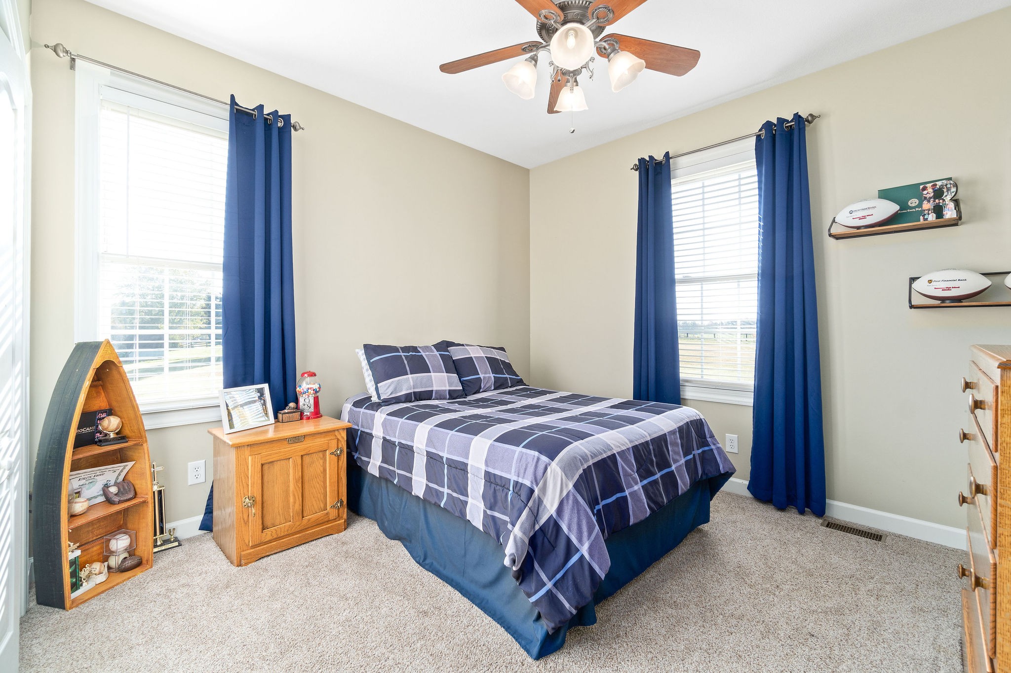 1488 Cooley Ford Road Tennessee Ridge, TN 37178 - Photo 28 of 46 a bedroom with a bed and a chandelier