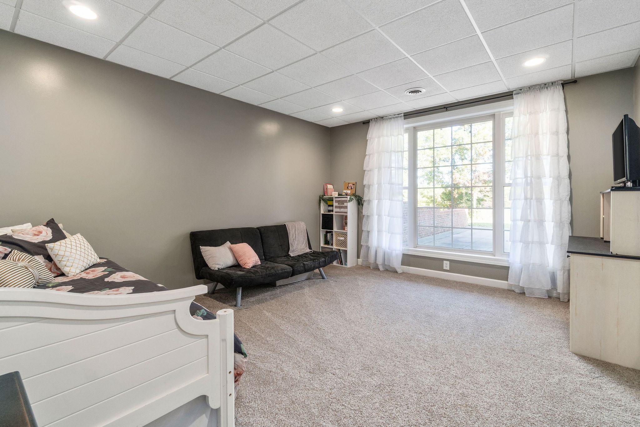 1488 Cooley Ford Road Tennessee Ridge, TN 37178 - Photo 32 of 46 a living room with furniture and a flat screen tv