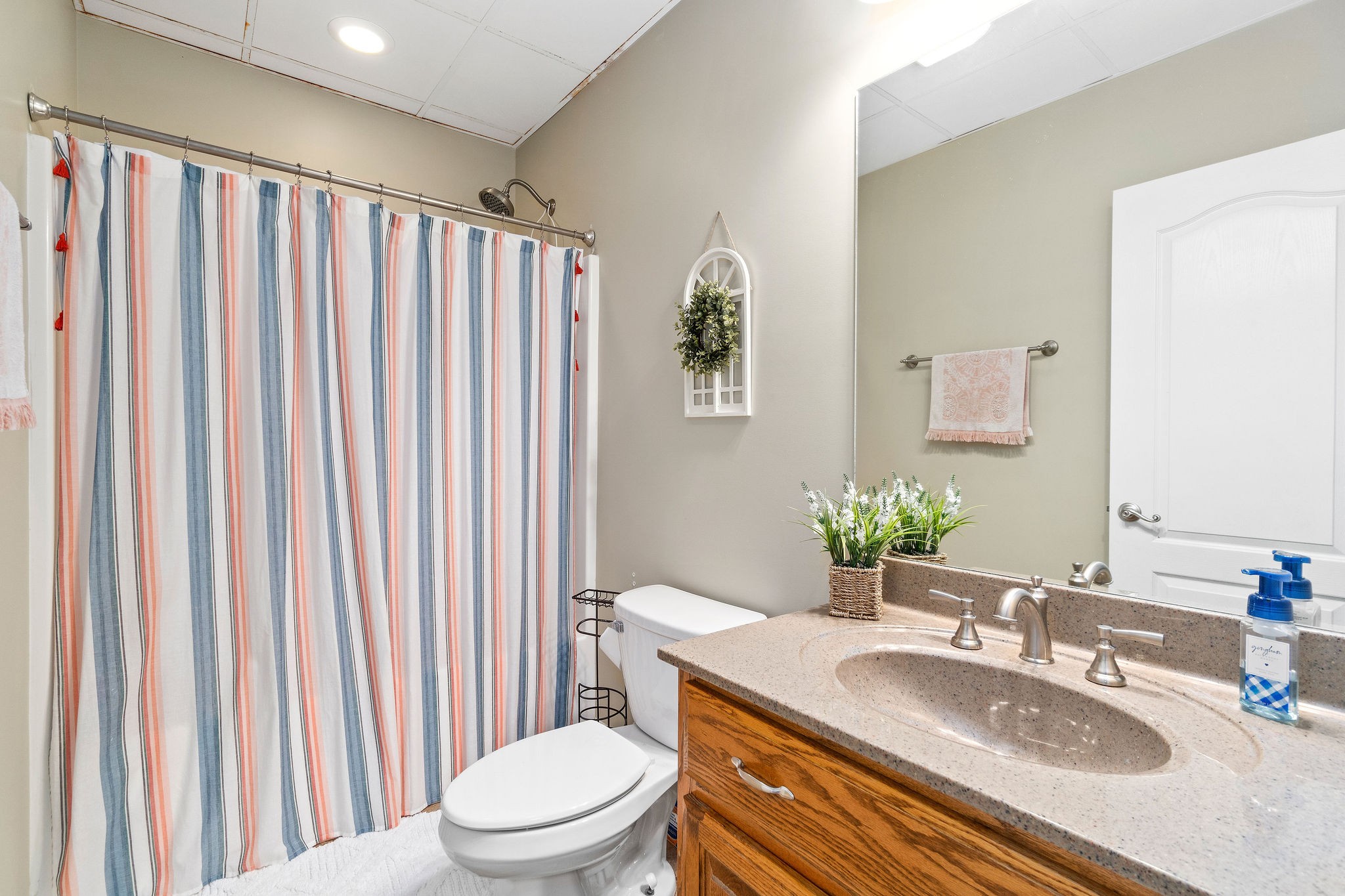 1488 Cooley Ford Road Tennessee Ridge, TN 37178 - Photo 33 of 46 a bathroom with a granite countertop sink vanity mirror and toilet