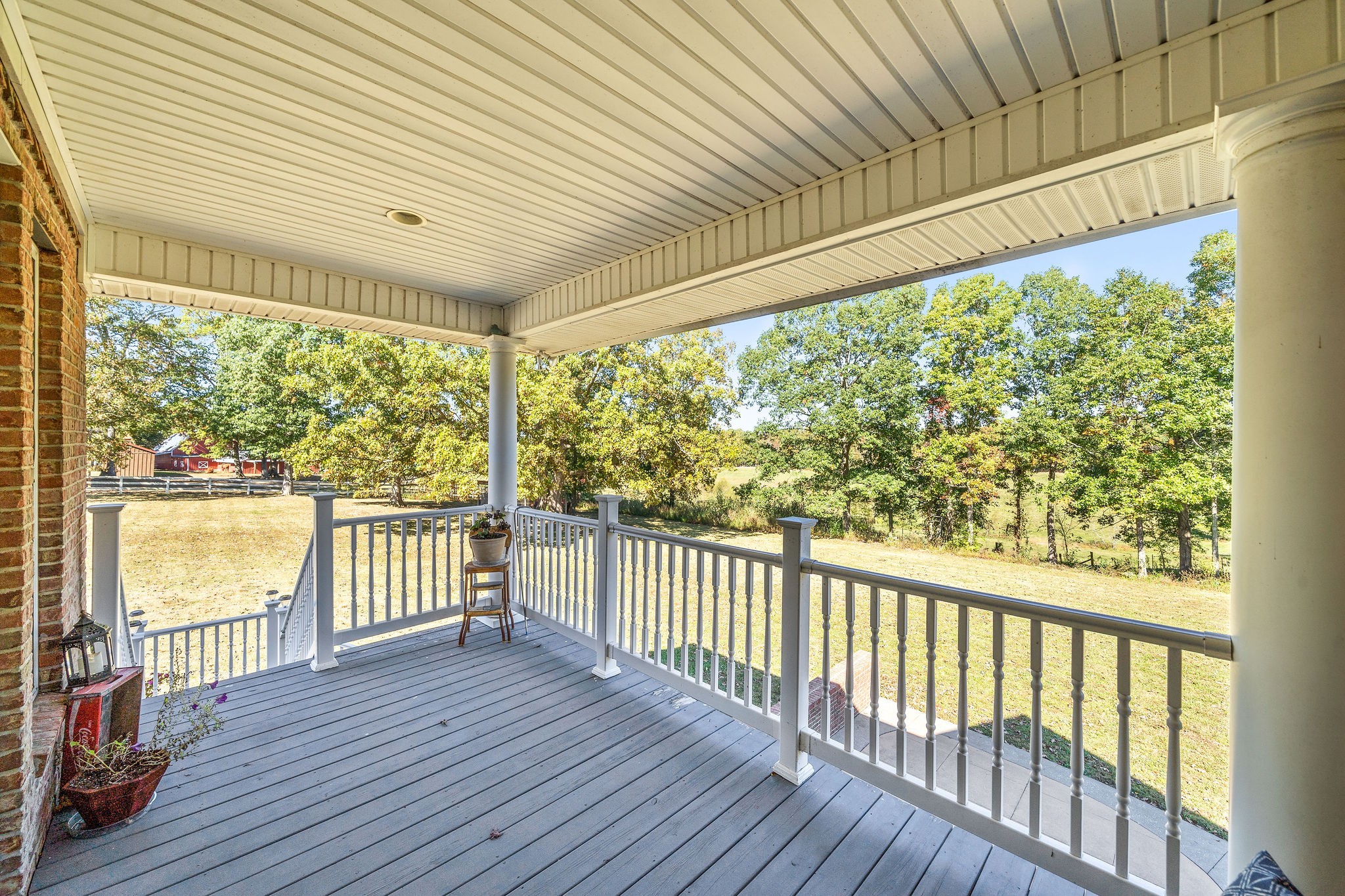 1488 Cooley Ford Road Tennessee Ridge, TN 37178 - Photo 39 of 46 a view of a room with wooden floor and iron stairs