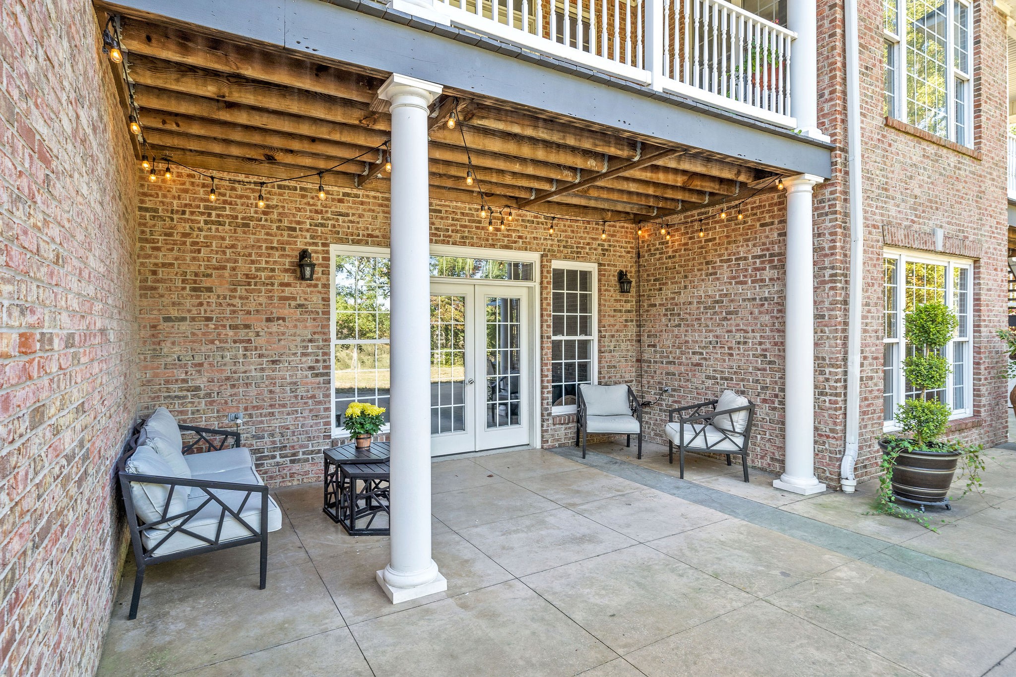 1488 Cooley Ford Road Tennessee Ridge, TN 37178 - Photo 41 of 46 a view of a patio with a table and chairs and potted plants