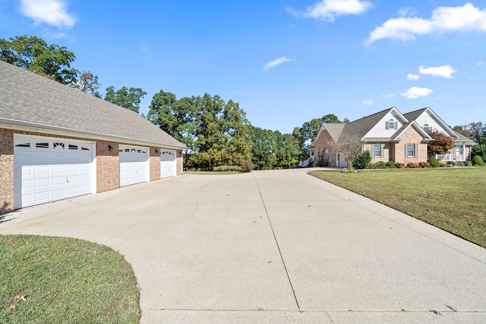 1488 Cooley Ford Road Tennessee Ridge, TN 37178 - Photo 42 of 46 a front view of a house with a yard and garage