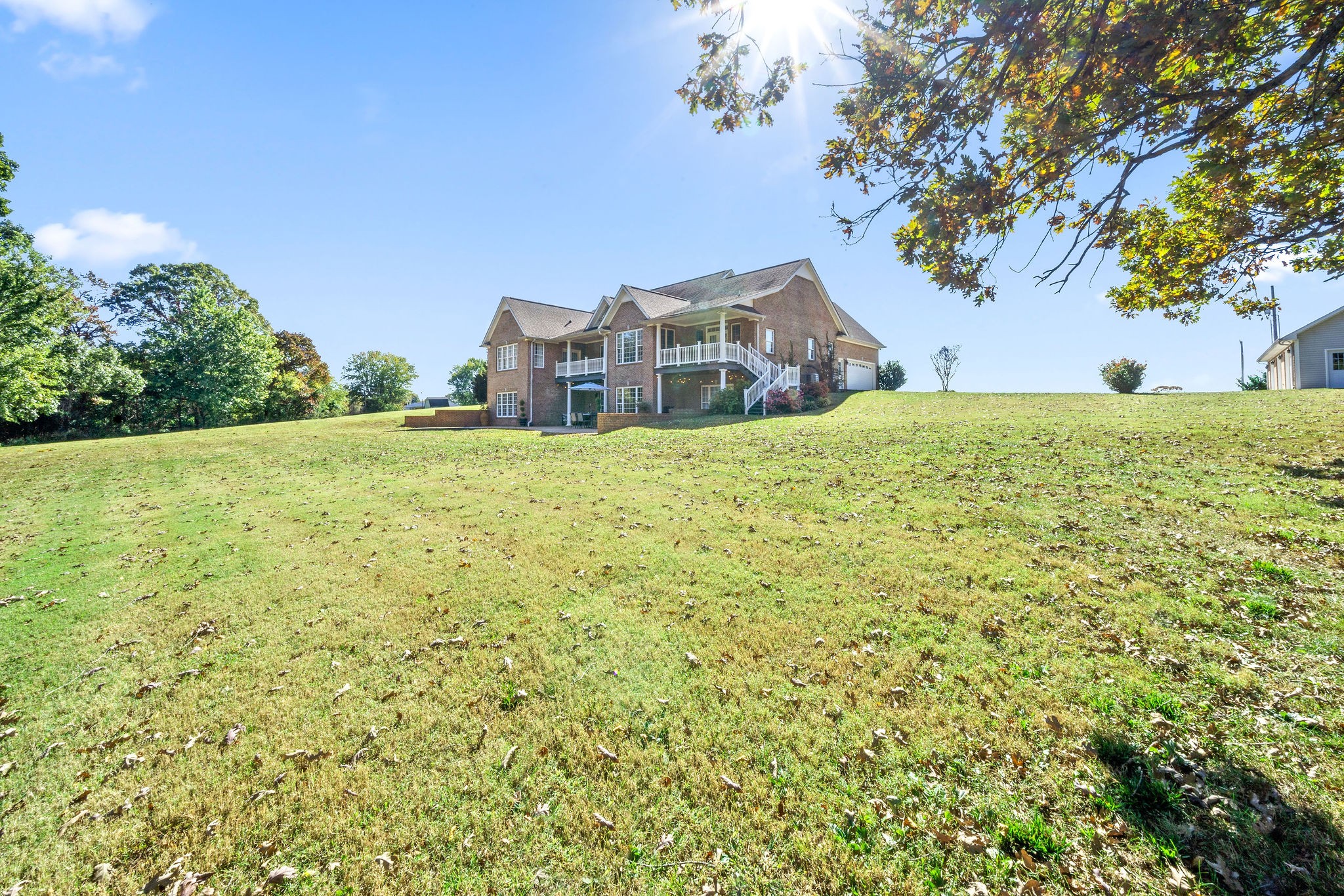 1488 Cooley Ford Road Tennessee Ridge, TN 37178 - Photo 45 of 46 a tall building with trees in front of it