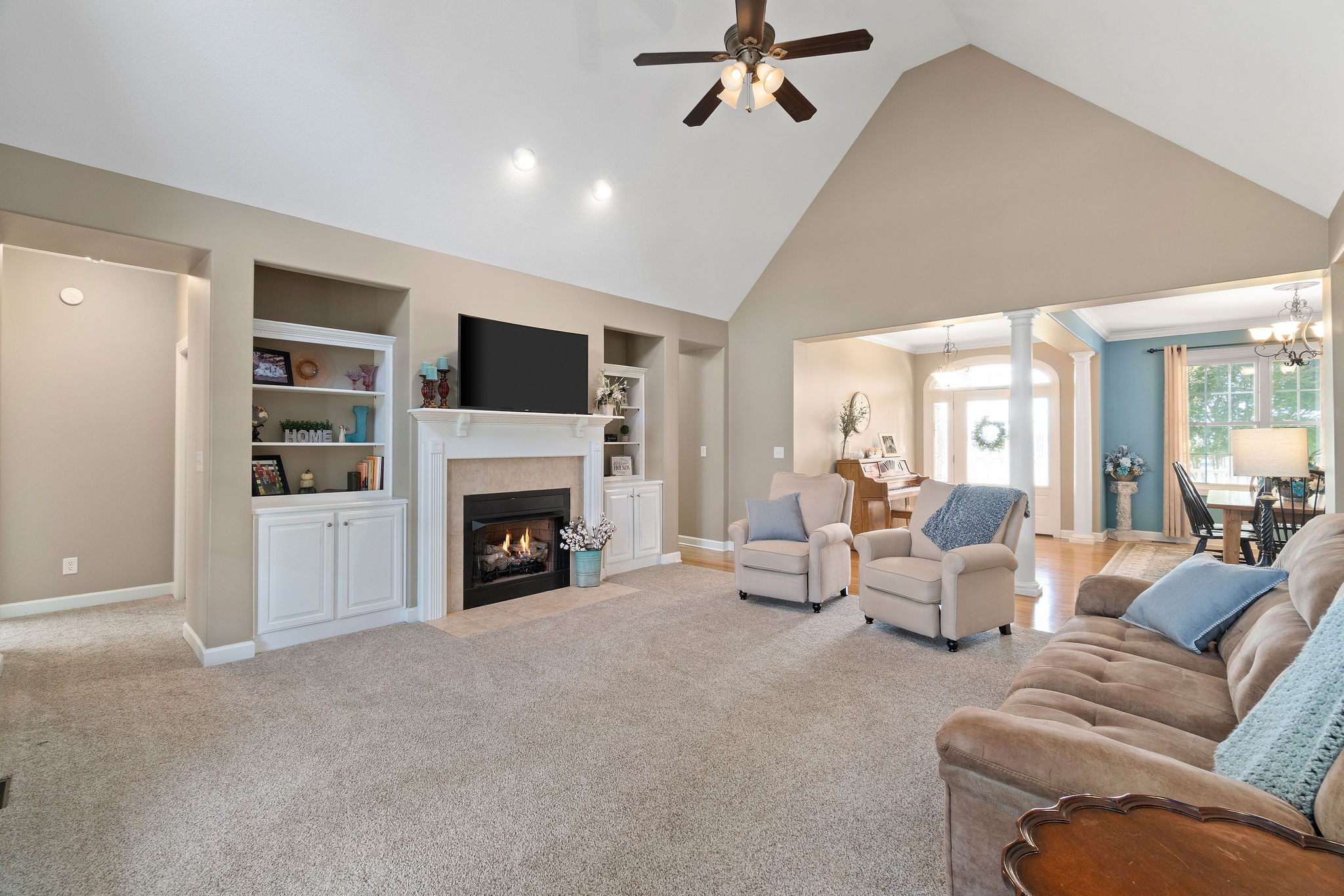 1488 Cooley Ford Road Tennessee Ridge, TN 37178 - Photo 7 of 46 a living room with furniture a fireplace and a flat screen tv