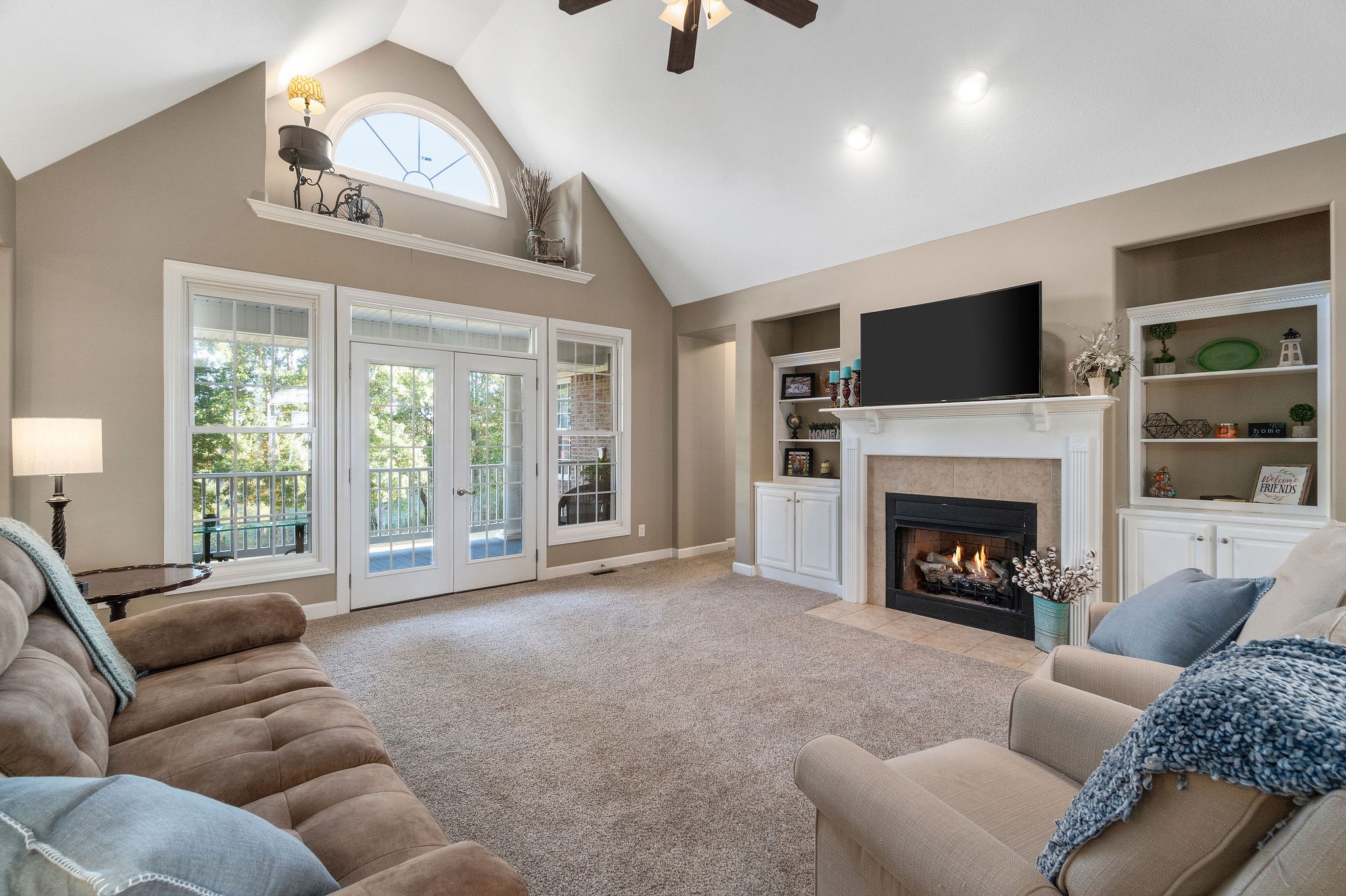 1488 Cooley Ford Road Tennessee Ridge, TN 37178 - Photo 8 of 46 a living room with furniture a fireplace and a flat screen tv