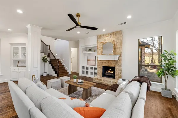 a living room with furniture and a fireplace