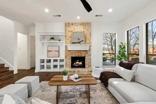 a living room with furniture and a fireplace