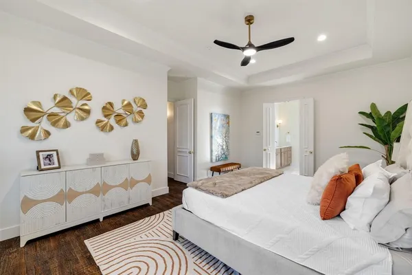a bedroom with a bed and a couch